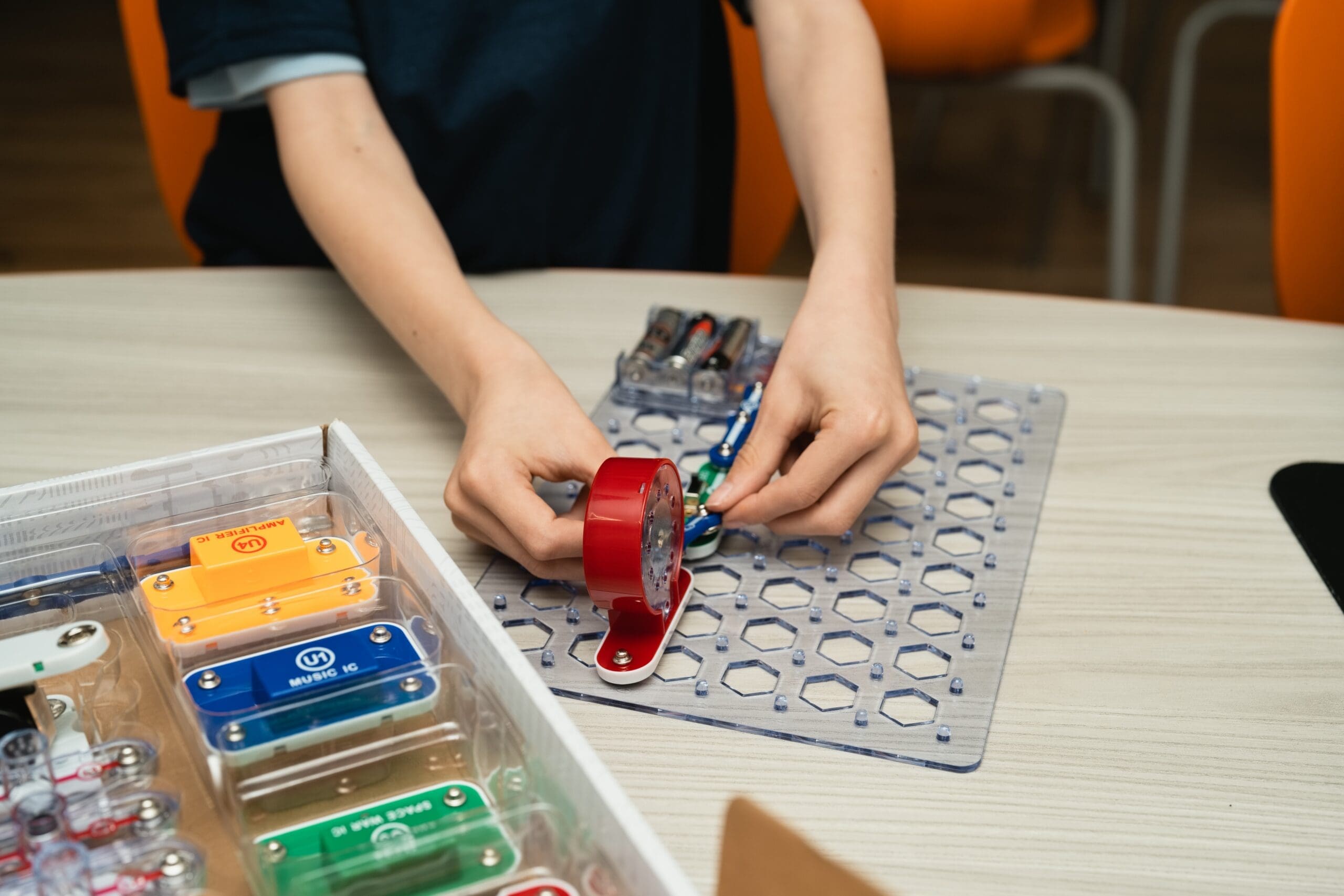 Middle school students building a robot at a Martinsburg WV robotics summer camp